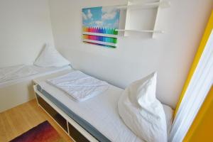 Postel nebo postele na pokoji v ubytování Grömitz-Center Whg 206