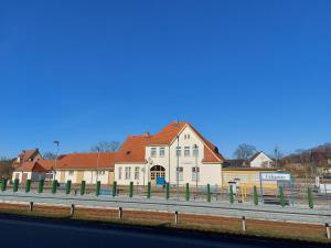 a large building on the side of a road at Moderne Ferienwohnung "Parkblick" im Ostseebad Ückeritz in Ueckeritz +14 photos