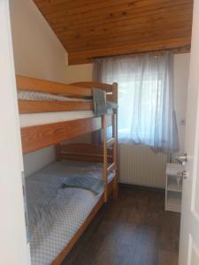 a room with two bunk beds and a window at Stari mlin - Old mill Šipovo in Šipovo