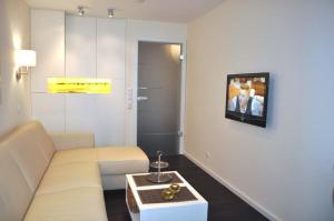 Μια τηλεόραση ή/και κέντρο ψυχαγωγίας στο Residenz Ostseestrand Ferienwohnung Nr 21 Meerblick