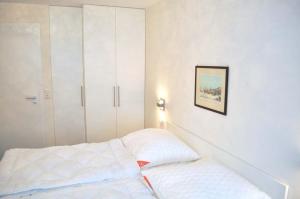 Ένα ή περισσότερα κρεβάτια σε δωμάτιο στο Residenz Ostseestrand Ferienwohnung Nr 21 Meerblick +8 φωτογραφίες