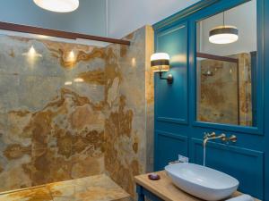 a bathroom with a sink and a shower at Palazzo Sapori in Soriano nel Cimino +34 photos