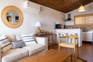 a living room with a couch and a table at Viña Edén in El Eden