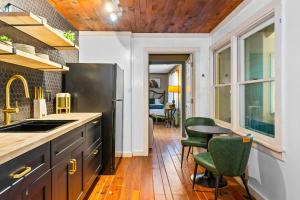 a kitchen with a sink and a table and chairs at North 40 Lodge and Cabin in Clarkesville