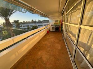 an empty corridor of a building with a window at Appartement Bouznika Bay Golf Beach in Bouznika