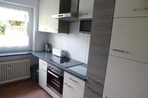 Kuchyň nebo kuchyňský kout v ubytování Ferienhaus Westhüs 1 + 22 fotografií