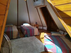Postel nebo postele na pokoji v ubytování Chalet confortable avec entrée privée à Pointe-Noire