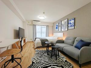TV a/nebo společenská místnost v ubytování Sidihome 365 Apartment