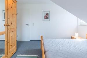 Postel nebo postele na pokoji v ubytování Ferienwohnung "Am Ostseeradweg"