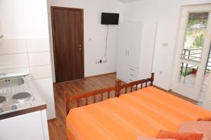Postel nebo postele na pokoji v ubytování Apartments Neda
