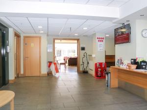 a lobby of a store with a waiting room at The Lifeboat Landing at Marine Court in Littlehampton