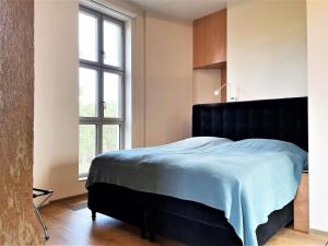Ein Bett oder Betten in einem Zimmer der Unterkunft Wasserturm Spreewitz