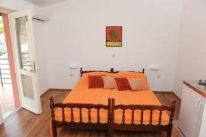 Postel nebo postele na pokoji v ubytování Apartments Neda