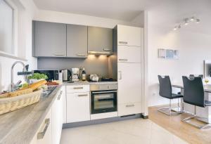 Kuchyň nebo kuchyňský kout v ubytování Apartments Vea