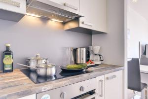 Kuchyň nebo kuchyňský kout v ubytování Apartments Vea