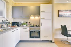 Kuchyň nebo kuchyňský kout v ubytování Apartments Vea