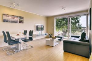 TV a/nebo společenská místnost v ubytování Apartments Vea