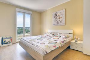 Postel nebo postele na pokoji v ubytování Apartments Vea