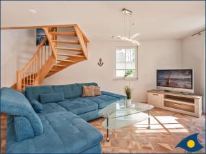 TV a/nebo společenská místnost v ubytování Fischerdorf Zirchow Küstenseeschwalbe