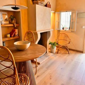a living room with a table and a fireplace at Casa Casco Antiguo Altea - La Toalla in Altea +56 photos