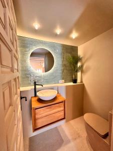 a bathroom with a sink and a mirror at Casa Altea Casco Antiguo in Altea