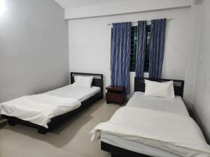 Postel nebo postele na pokoji v ubytování Neelima Resort