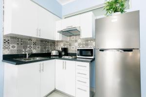 Cucina o angolo cottura di GRAND CARIBE STUDIOS and SUITES playa LOS CORALES