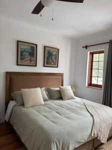 a bedroom with a large bed with two pillows at Hotel Boutique La Residencia in Lima