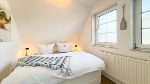 Ένα ή περισσότερα κρεβάτια σε δωμάτιο στο Strandwild +16 φωτογραφίες