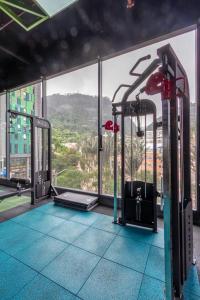 a gym with a view of the city at Cozy and centrally located flat near Monserrate - 11009 in Bogotá