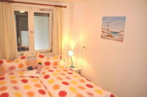 Ένα ή περισσότερα κρεβάτια σε δωμάτιο στο Lille Hus Ferienhaus +10 φωτογραφίες