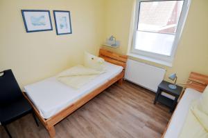 Voodi või voodid majutusasutuse Möwenstrasse oben toas