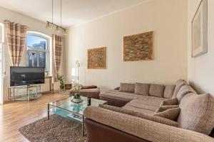 TV a/nebo společenská místnost v ubytování Villa Seiler Fewo 5 3-Raum Apartment