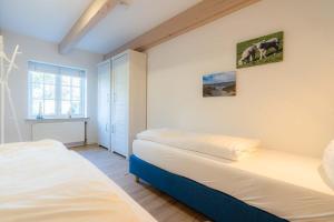 Postel nebo postele na pokoji v ubytování Wohnung 6 Suederoog ID 475 + 12 fotografií