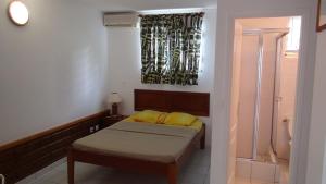 Postel nebo postele na pokoji v ubytování Appartement vue paradisiaque