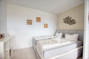 Кровать или кровати в номере Ferienpark - Haus L, App 0L0610