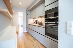 Dapur atau dapur kecil di Quartier am Strand - App 07