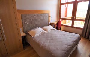 Ένα ή περισσότερα κρεβάτια σε δωμάτιο στο Les Arcs Résidence Les Monarques by Leavetown Vacations +6 φωτογραφίες