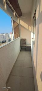 a empty hallway with a chair in a building at Golf msnana in Tangier