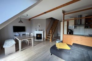 Televiisor ja/või meelelahutuskeskus majutusasutuses Ferienwohnung Mühlenidyll