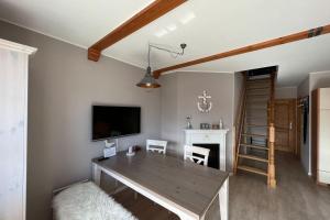 Televiisor ja/või meelelahutuskeskus majutusasutuses Ferienwohnung Mühlenidyll