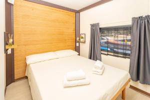 a bedroom with two beds and a window at Hoceanika Houseboat Porto Rotondo in Porto Rotondo
