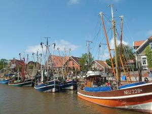 a group of boats docked in the water near houses at Stedesdorf, Ferienwohnung '9 und 40' in Stedesdorf