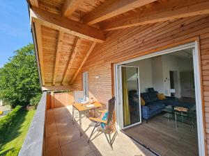 an outdoor patio with a couch and a table at Ferienwohnungen Gottschlicht in Oberhof