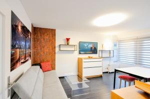 a living room with a couch and a table at Matzlow, Fewo Voss in Garwitz