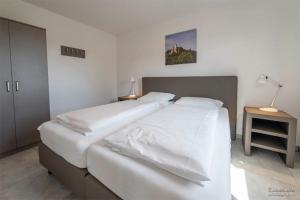 Postel nebo postele na pokoji v ubytování Panoramahaus Premium Typ 100 + 3 fotografie