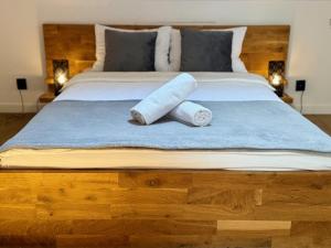 Posteľ alebo postele v izbe v ubytovaní Maya Pokoje i Apartamenty