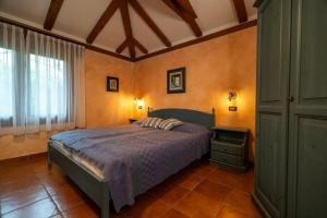 Postel nebo postele na pokoji v ubytování Toscana