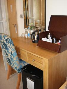 a desk with a chair and a computer on it at Ennios Boutique Hotel in Southampton