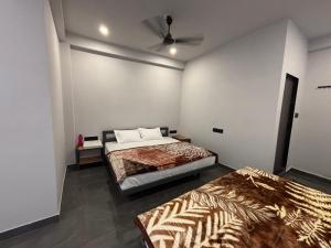 Postel nebo postele na pokoji v ubytování Unity homestay